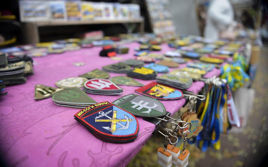 Unit patches and other military regalia are the biggest sellers for street vendors in Kyiv, Ukraine, who said on Aug. 27, 2022, that most customers are members of the military, both Ukrainians and foreign fighters, or people buying gifts for Ukrainian refugees abroad.