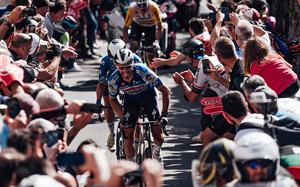 Riders make their way through the crowd during a stage of the Giro d’Italia. This year's Giro starts Friday, with stops in Naples, Vicenza, Pisa and Pordenone.