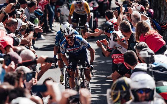 Riders make their way through the crowd during a stage of the Giro d’Italia. This year's Giro starts Friday, with stops in Naples, Vicenza, Pisa and Pordenone.