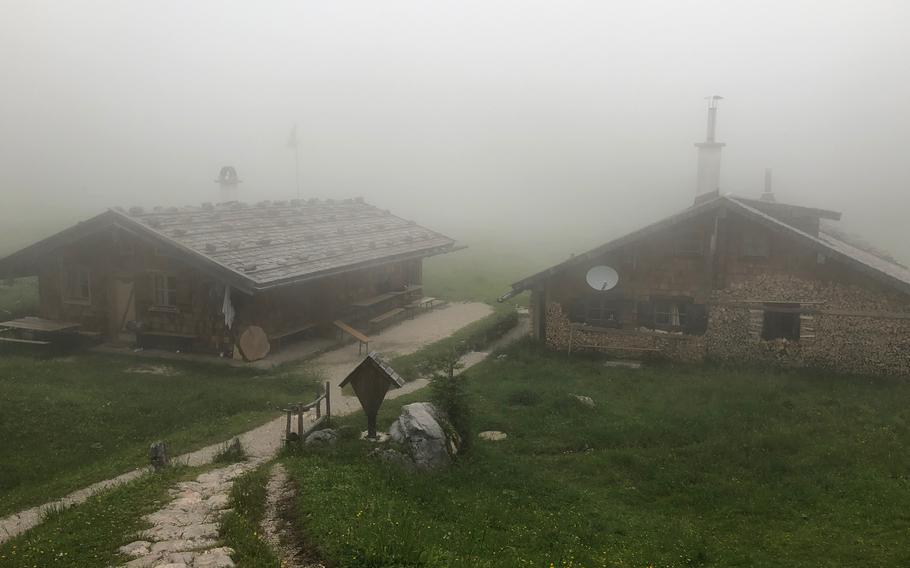 Fog surrounds the Wasseralm in der Röth, located in the Hagen Mountains of Berchtesgaden National Park on June 28, 2022. Many of the huts in the Berchtesgaden National Park, and throughout the Alps of Germany, Italy, Austria, and Switzerland, are serious concrete-and-steel-girder structures, built to stand year-round. 
