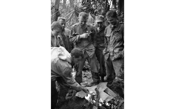 At the foot of Hill 484, South Vietnam, Oct. 9, 1966: Marines lite a fire in the morning to warm themselves after a night of rain, trying to warm up some grub. The marines from 3rd Battalion, 4th Marine Regiment are battlingNorth Vietnamese army troops for Hill 484.

META TAGS: Vietnam war; Vietnam; war; combat; USMC; Marines; Marine Corps; Landing Zone Mack; Hill 484; NVA