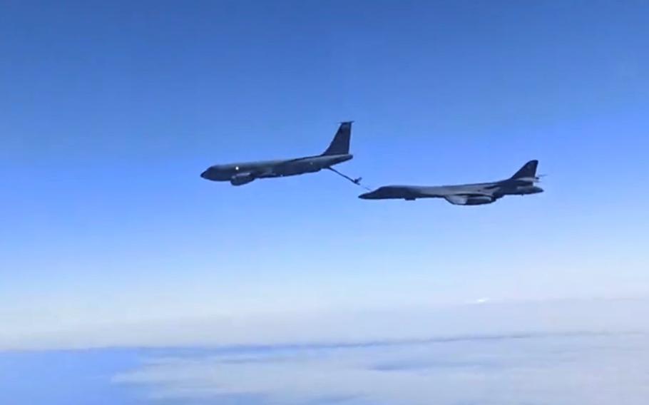 A U.S. Air Force KC-135 Stratotanker refuels a B-1B Lancer in flight over the Black Sea, Oct. 19, 2021. This still image from video was recorded by Russian crew members aboard a Sukhoi Su-30 fighter jet, which mobilized in response to the U.S. flights over international waters.