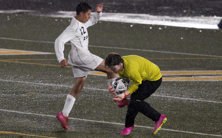 Ethan Young grabs the ball from Thomas Diaz.