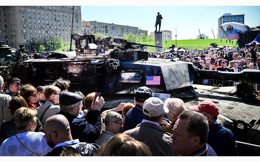 People look at US M12A1 Abrams tank captured by Russian forces in Ukraine, displayed at the WWII memorial complex at Poklonnya Hill western in Moscow, on May 1, 2024. The Russian Ministry of Defence opened an exhibition of samples of “Western weapons and military equipment” captured by Russian forces in Ukraine. The exhibition will last for one month. 