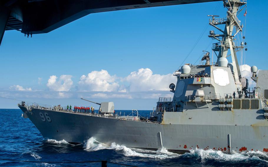 The destroyer USS Bainbridge sails the Mediterranean Sea alongside the aircraft carrier USS Harry S. Truman during a simulated replenishment-at-sea, Jan. 21, 2022. 