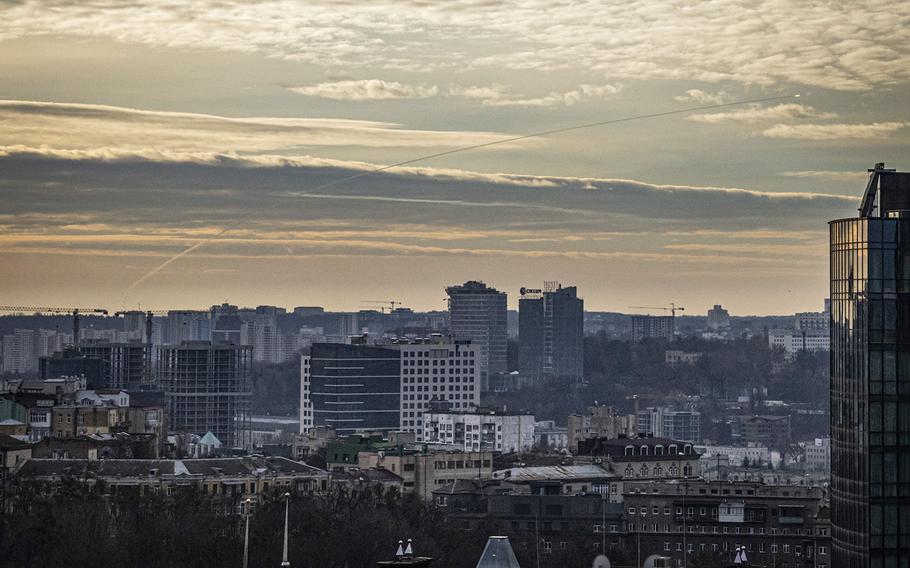A projectile streaks across the sky over central Kyiv in late December 2022.