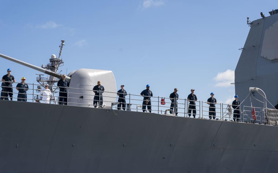 Sailors man the rails as the guided-missile cruiser USS Leyte Gulf departs Naval Station Norfolk, Va., on Aug. 8, 2022. The ship, assigned to the George H.W. Bush Carrier Strike Group, departed Norfolk on a scheduled deployment.