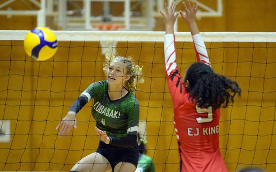 Kubasaki's Emma Leggio spikes against E.J. King's Kaitlyn Mapa during Saturday's YUJO tournament semifinal. The Dragons won in two sets and went on to win the championshp. The Cobras went on to finish third.