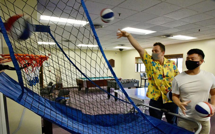 Service members shoot hoops at a recreation area on Kadena Air Base, Okinawa, Friday, Jan. 21, 2022.