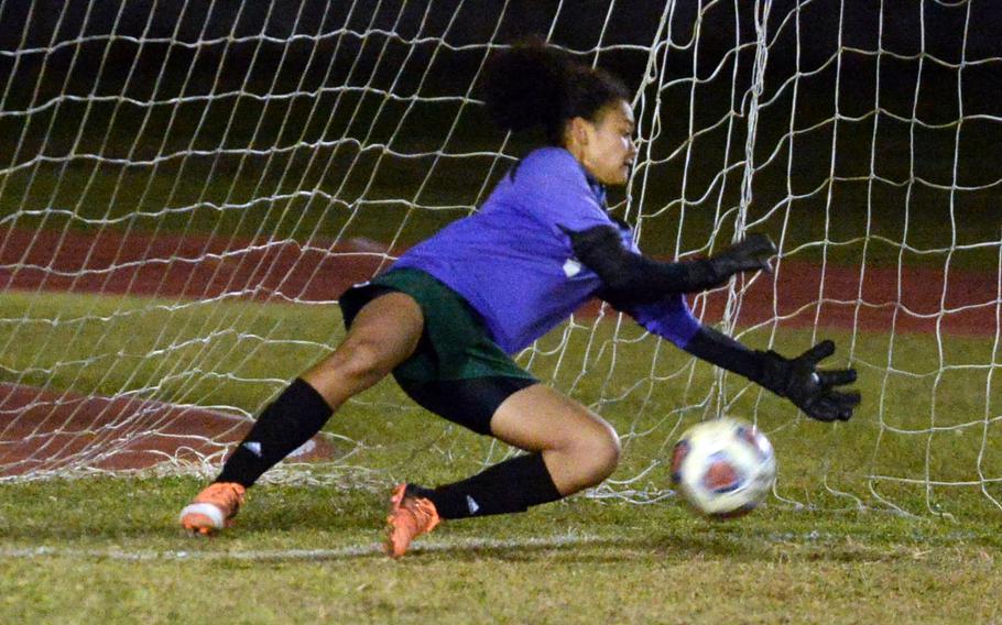 Kubasaki goalkeeper Charlene Darsan stops a Kadena penalty kick during Wednesday’s DODEA-Okinawa girls soccer match. The Dragons beat the Panthers 1-0 for the second time in two weeks.