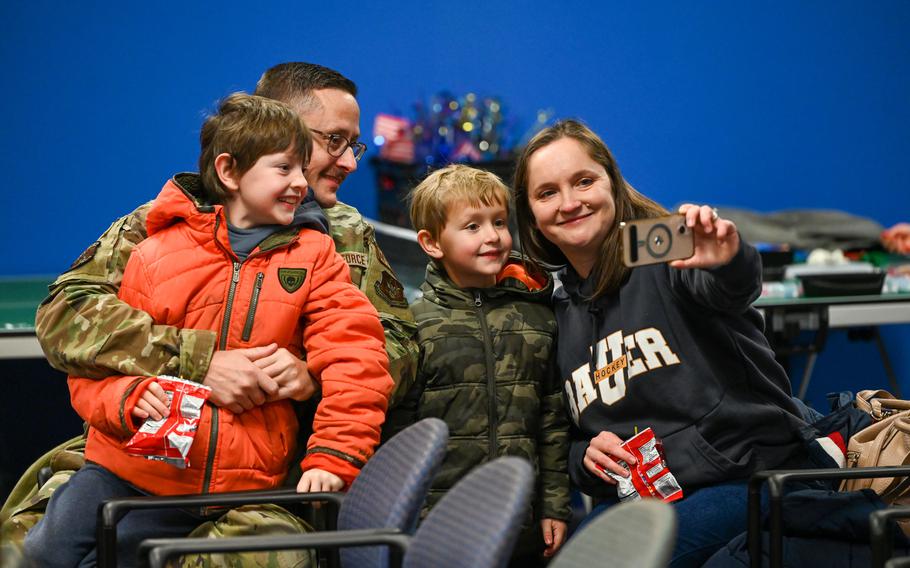 An airman with the 445th Airlift Wing reunites with family members at Wright-Patterson Air Force Base, Ohio, Jan. 4, 2024. 