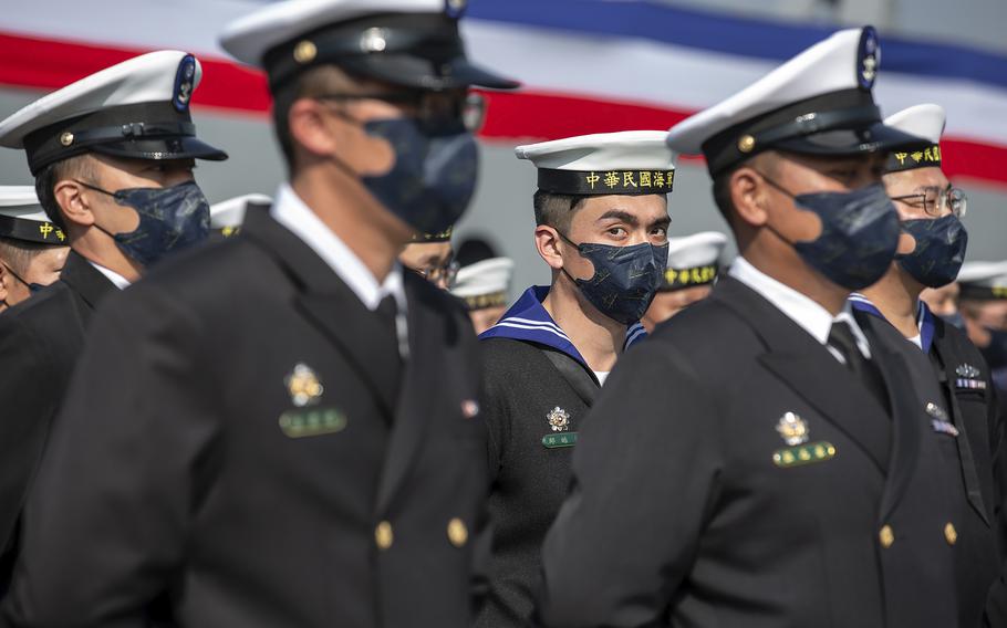 Taiwanese sailors form up infront of newly commissioned navy minelayers in Kaohsiung city in southern Taiwan on Friday, Jan. 14, 2022.
