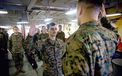 Marine Corps Sgt. Joshua Martinez, who has autism, reenlists aboard the amphibious assault ship USS America, Aug. 8, 2021. 