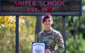 U.S. Army Sgt. Maciel Hay, a cavalry scout with 1st Squadron, 91st Cavalry Regiment, 173rd Airborne Brigade, poses for a photo after graduating sniper school at Fort Moore, Ga., Nov. 3, 2023. Hay is the first active-duty female U.S. Army sniper. 
