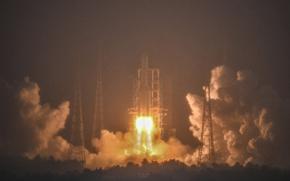 In this photo provided by China's Xinhua News Agency, a Long March-5 rocket, carrying the Chang'e-6 spacecraft, blasts off from its launchpad at the Wenchang Space Launch Site in Wenchang, south China's Hainan Province, Friday, May 3, 2024. China on Friday launched a lunar probe to land on the far side of the moon and return with samples that could provide insights into differences between the less-explored region and the better-known near side. (Guo Cheng/Xinhua via AP)