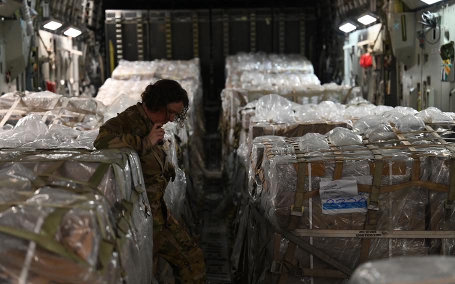 Air Force Master Sgt. Caroline Sussman inspects humanitarian aid aboard a C-17 Globemaster on Nov. 28, 2023. The aid will be distributed to people in Gaza.