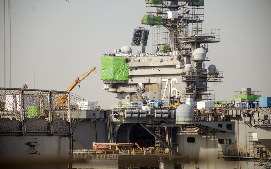 The aircraft carrier USS Ronald Reagan undergoes maintenance at Yokosuka Naval Base, Japan, Feb. 17, 2023.