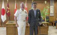 In this image made from a video, U.S. Pacific Fleet commander Adm. Sam Paparo, left, and Japanese Defense Minister Nobuo Kishi pose for media at the Defense Ministry in Tokyo, Friday, June 24, 2022. The U.S. Navy’s top commander in the Pacific and the Japanese defense minister on Friday said close cooperation between their naval forces is more important than ever amid rising tensions over China, North Korea and Russia. (AP Photo)