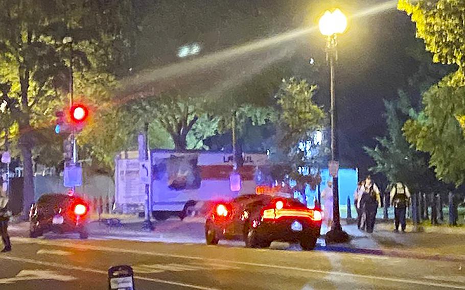 A truck is seen crashed into a security barrier at a park across from the White House, Monday night, May 22, 2023 in Washington.