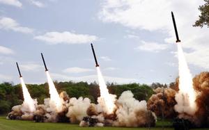 A image from the state-run Korean Central News Agency shows North Korea firing missiles from mobile launchers on April 22, 2024.