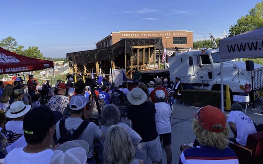 Crowds of people attend a dedication of a WWII-era PA31-17 “Higgins Boat” at the Nebraska National Guard Museum in Seward, Neb., on July 4, 2023.