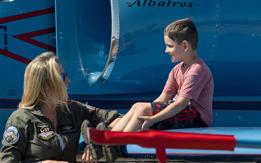 Stephanie Boss Goetz talks with a boy as he sits on the wing of her Aero L-39 Albatros at the California Capital Airshow on Sept. 24, 2023, at Mather Airport.