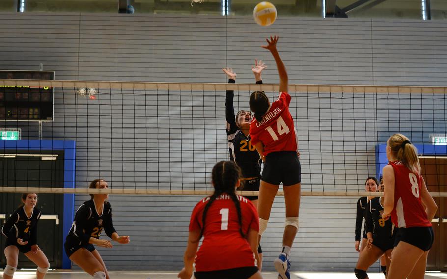 Lakenheath Lancer A’lydia McNeal spikes the ball across the net as Stuttgart’s Ainsley Baker tries to block her shot during the 2022 DODEA-Europe Volleyball Tournament, Thursday, Oct. 27, 2022, at Ramstein Air Base, Germany.