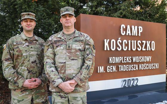 V Corps first active duty and reservist soldiers to receive permanent change of station orders to Poland, Sgt. Walter Malecki, left, and Sgt. 1st Class Kyle Stewart, pose for a picture March 8, 2023, at Camp Kosciuszko in Poznan, Poland.