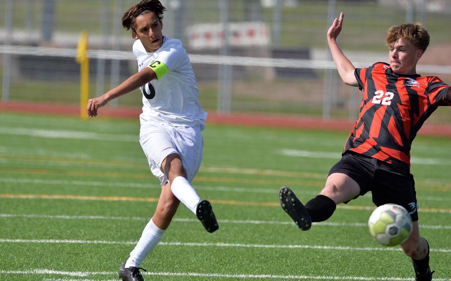 Naples’ Thomas Albright shoots on goal against AOSR’s Riley Smith in the boys Division II final at the DODEA-Europe soccer championships in Ramstein, Germany, May 18, 2023. AOSR beat Naples 5-1 to take the 2023 title.