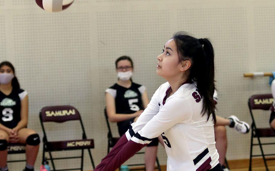 Matthew C. Perry's Haleigh Quinn bumps the ball against Nile C. Kinnick during Saturday's Japan girls volleyball match. The Red Devils won in straight sets.