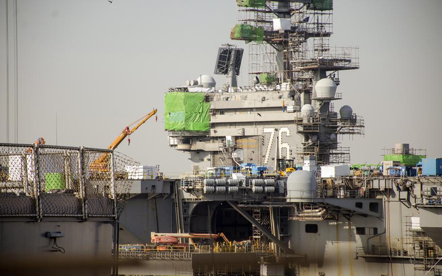 The aircraft carrier USS Ronald Reagan undergoes maintenance at Yokosuka Naval Base, Japan, Feb. 17, 2023. 