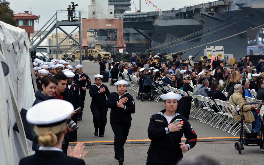 Ship’s crew members of USS John L. Canley man the ship during the ship’s commissioning ceremony on Feb. 17, 2024, at Naval Air Station North Island, Calif.