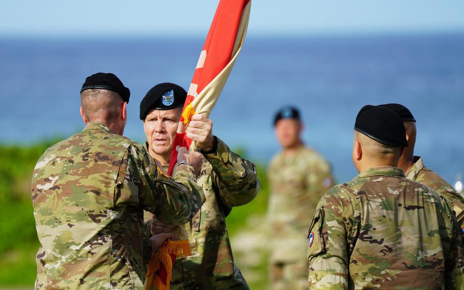 Army Col. Ned Holt accepts the unit colors and takes command of the 10th Support Group at Torii Station, Okinawa, Thursday, July 14, 2022.