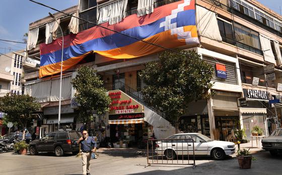 A giant flag of Nagorno-Karabakh region hanged on a building, in the main Armenian district of the northern Beirut suburb of Bourj Hammoud, Lebanon, Monday, Sept. 25, 2023. The swift fall of the Armenian-majority enclave of Nagorno-Karabakh to Azerbaijani troops and exodus of much of its population has stunned the large Armenian diaspora around the world. (AP Photo/Hussein Malla)