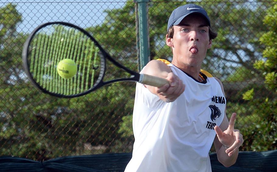 Kadena's Evan Davis smacks a forehand return against Kubasaki's Owen Ruksc during Thursday's Okinawa tennis matches. Ruksc won 8-5.