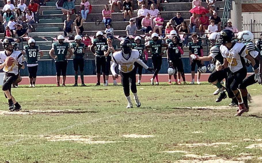 Vicenza quarterback Logan Sistare looks for an open receiver down field in the Cougars' 42-0 loss to the Naples Wildcats on Saturday, Oct. 8, 2022.