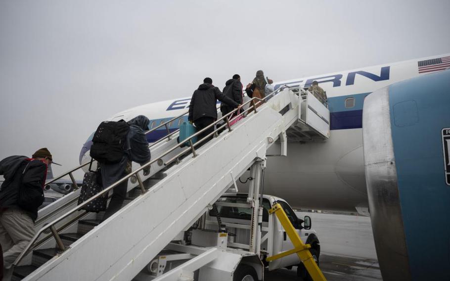 Afghan evacuees board the final outbound flight to the United States from Ramstein Air Base, Germany, Oct. 30, 2021.