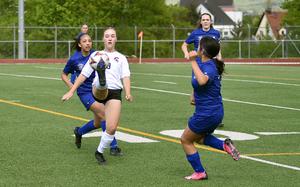 Kaiserslautern attacker Lola Wesseler controls a ball in the air between Wiesbaden defenders Jocelyn Browne, left, and Emily Arocan, right, during an April, 19, 2025, match at Wiesbaden High School in Wiesbaden, Germany.