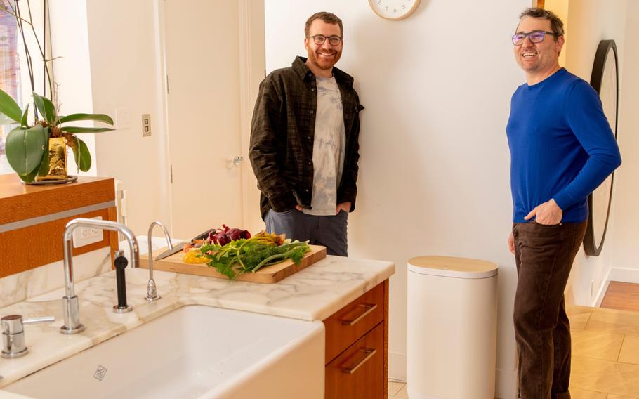 Harry Tannenbaum, left, and Matt Rogers, of the startup Mill, with a prototype of their Kitchen Bin. 