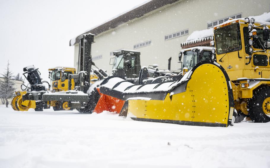 Heavy machinery positioned outside of vehicle operations at Misawa Air Base, Japan, Jan. 20, 2022, is ready to move snow as fast as it falls on one of the snowiest places on Earth. 