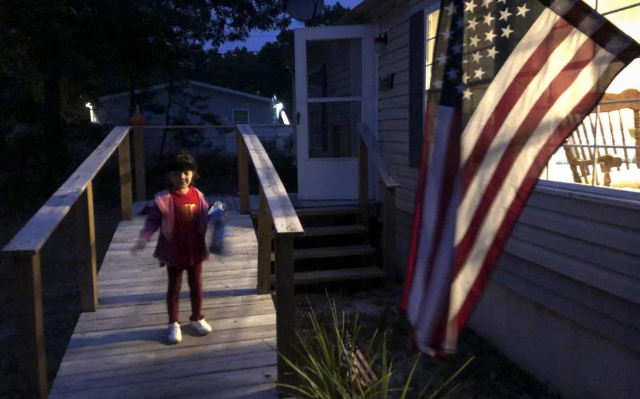 Zainab Asadi, 5, heads up a ramp to her house in the suburbs of Atlantic City, N.J. 