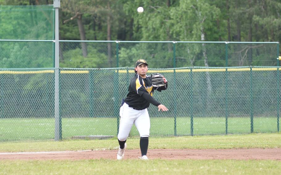 Stuttgart third baseman Ryan Santana throws to first base during the Division I DODEA European baseball championship game against Ramstein on May 20, 2023, at Southside Fitness Center on Ramstein Air Base, Germany. 