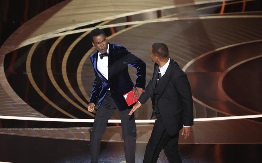 Chris Rock, left, and Will Smith onstage during the 94th Academy Awards at the Dolby Theatre on March 27, 2022, in Hollywood, California. 