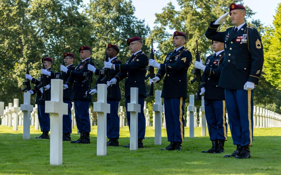 Soldiers from the 173rd Infantry Brigade Combat Team present arms during the military burial ceremony for U.S. Army Air Forces 2nd Lt. William J. McGowan at Normandy American Cemetery, France, on July 9, 2022.