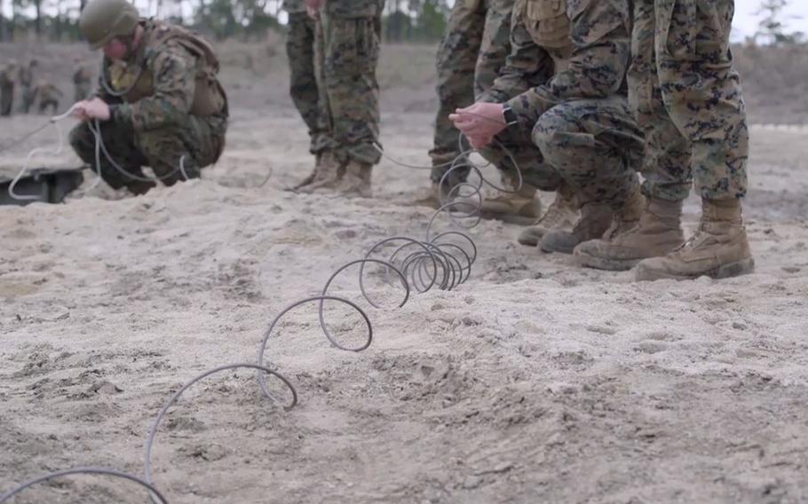 Marines train with plastic explosives at Marine Corps Engineer School at Camp Lejeune in Jacksonville, North Carolina.