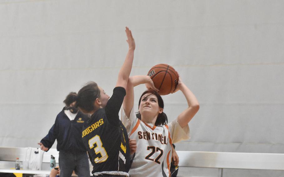 Ansbach's Trinity Batin can't stop Spangdahlem's Maddisyn Glover from scoring on Wednesday, Feb. 23, 2022, at the DODEA-Europe Division III basketball championships at Ramstein Air Base in Germany.
