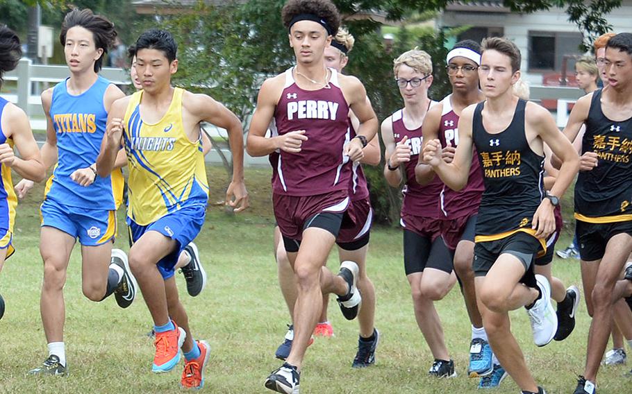 Matthew C. Perry junior Tyler Gaines, middle, begins Saturday's trek over the Tama Hills Recreation Center lower 5-kilometer course.