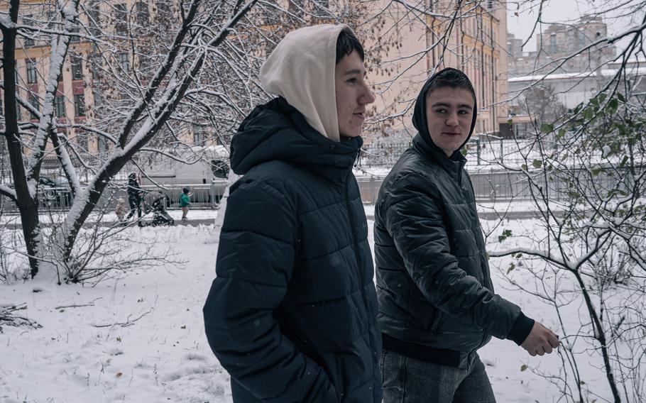 Rostyslav Lavrov and Denys Berezhnyi walk in Kyiv, Ukraine, on Nov. 22, 2023.