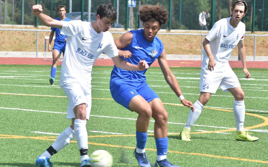 Ramstein's Maxim Speed, right, and Black Forest Academy's Rafael Widmer battle for the ball Wednesday, May 18, 2022, at the DODEA-Europe boys Division I soccer semifinals at Ramstein Air Base. Speed later scored the game's only goal.