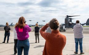 Yokota spouses take pictures of take off during CV-22 Osprey incentive flight, provided by the 353rd Special Operations Wing, at Yokota Air Base, Japan, May 12, 2023. Every spouse on the installationÐhome to the 374th Airlift Wing, Fifth Air Force, and U.S. Forces JapanÐwas invited to participate. Over 200 spouses rushed to sign up for the opportunity to fly on the Osprey, and even more got to experience the CV-22 simulator. (U.S. Air Force photo by Senior Airman Brooklyn Golightly)  